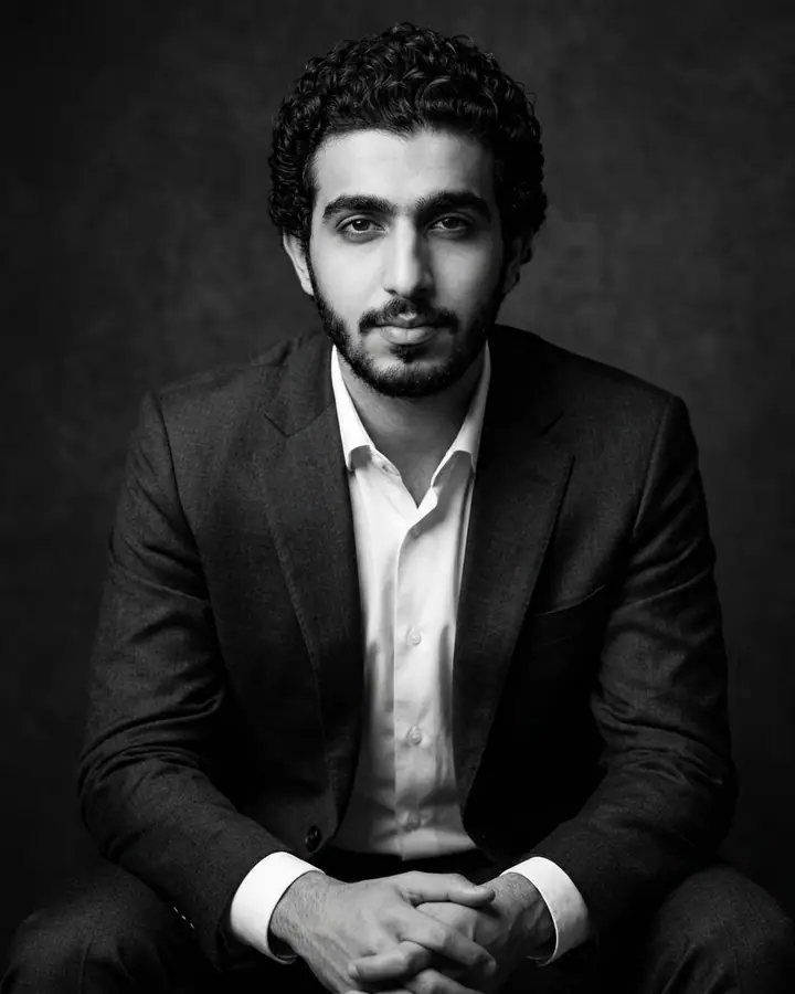 AI example of a black-and-white executive portrait of a man in a dark suit
