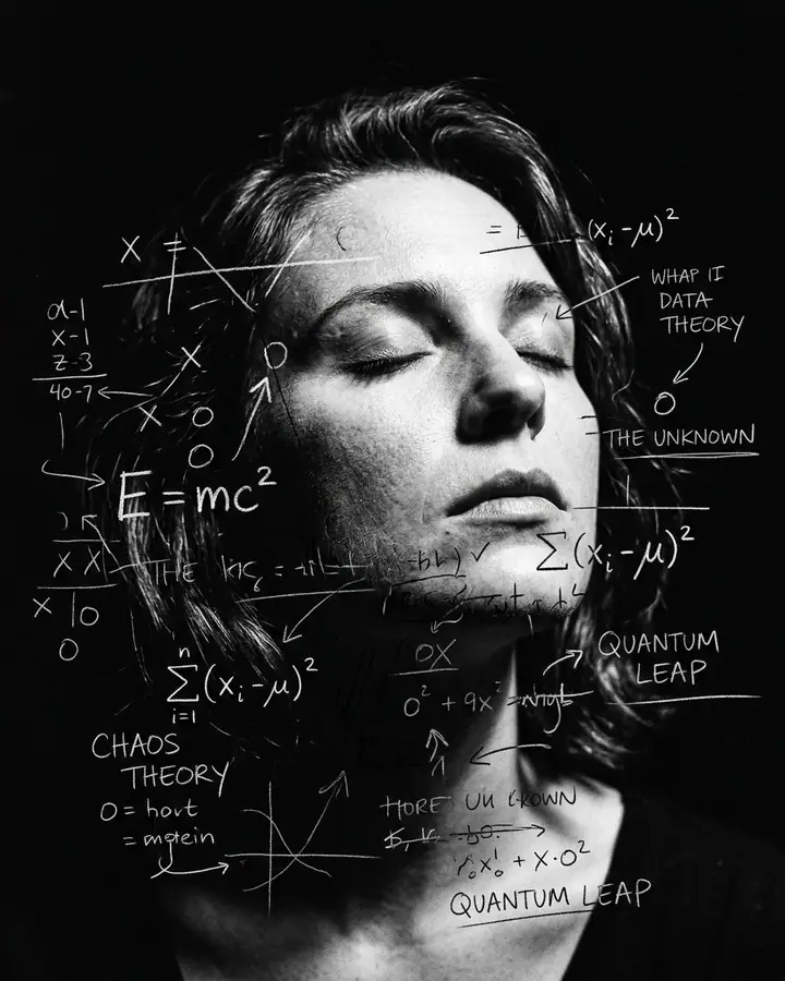 Black and white close-up of a woman with eyes closed, surrounded by white chalk scribbles